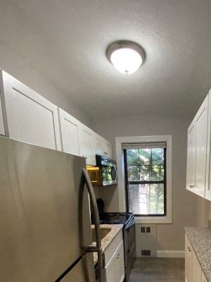 Kitchen Kitchen with granite counters, white cabinets and stainless appliances